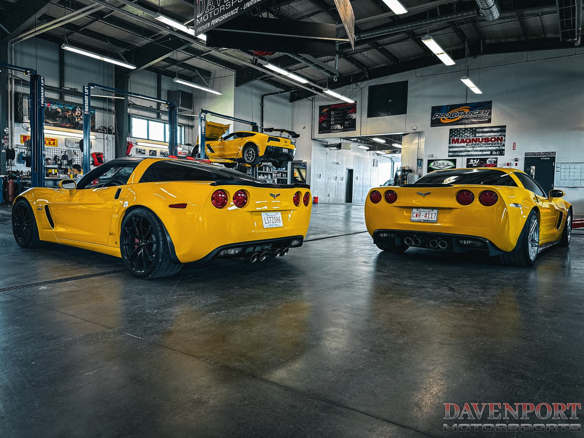 Three yellow Corvettes inside Davenport Motorsports